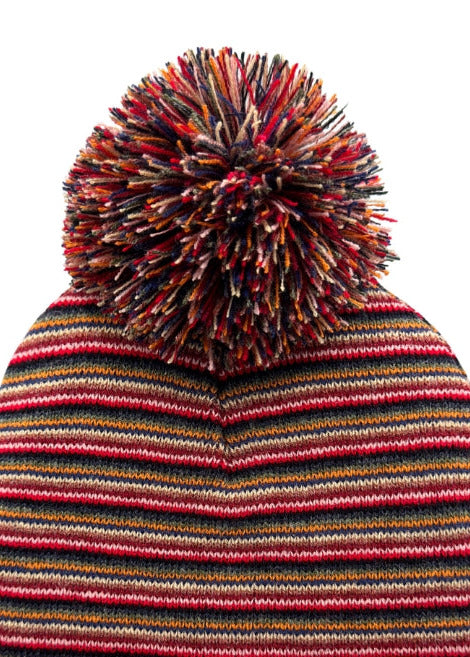 Multicolored striped beanie with a pom-pom on a white background